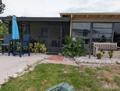 This house is located less than 1000 ft. from Three Sisters on Plantation Inn and Golf Resort  in Florida - for sale on GolfHomes.com, golf home, golf lot