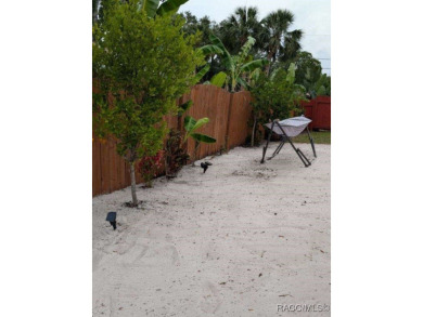This house is located less than 1000 ft. from Three Sisters on Plantation Inn and Golf Resort  in Florida - for sale on GolfHomes.com, golf home, golf lot
