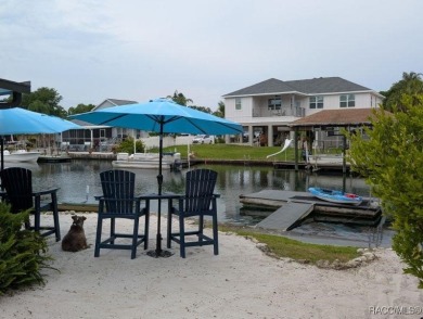 This house is located less than 1000 ft. from Three Sisters on Plantation Inn and Golf Resort  in Florida - for sale on GolfHomes.com, golf home, golf lot