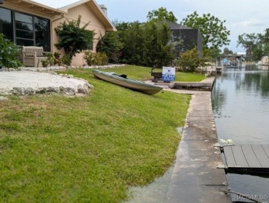 This house is located less than 1000 ft. from Three Sisters on Plantation Inn and Golf Resort  in Florida - for sale on GolfHomes.com, golf home, golf lot