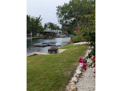 This house is located less than 1000 ft. from Three Sisters on Plantation Inn and Golf Resort  in Florida - for sale on GolfHomes.com, golf home, golf lot