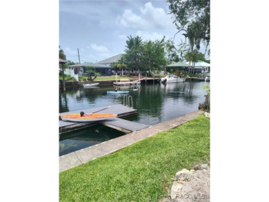 This house is located less than 1000 ft. from Three Sisters on Plantation Inn and Golf Resort  in Florida - for sale on GolfHomes.com, golf home, golf lot