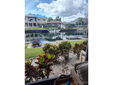 This house is located less than 1000 ft. from Three Sisters on Plantation Inn and Golf Resort  in Florida - for sale on GolfHomes.com, golf home, golf lot