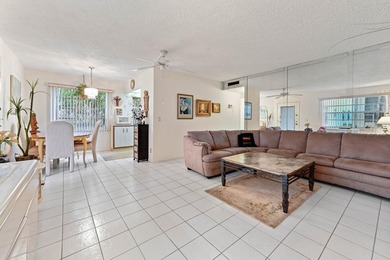 Welcome inside a vibrant first-floor unit located in the on Kings Point Golf -Flanders Way in Florida - for sale on GolfHomes.com, golf home, golf lot