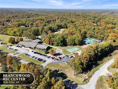 A peaceful, wooded lot in Bella Vista with a natural slope and a on Branchwood Golf Course in Arkansas - for sale on GolfHomes.com, golf home, golf lot