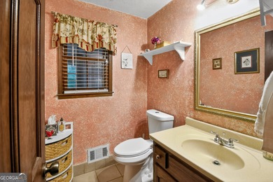 Welcome to this beautifully maintained Colonial-style brick home on West Pines Golf Club in Georgia - for sale on GolfHomes.com, golf home, golf lot