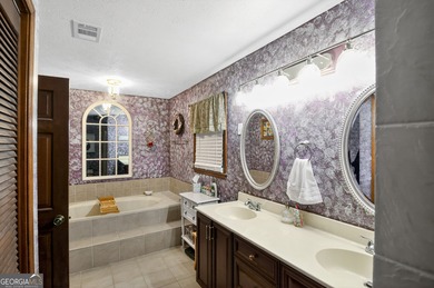 Welcome to this beautifully maintained Colonial-style brick home on West Pines Golf Club in Georgia - for sale on GolfHomes.com, golf home, golf lot