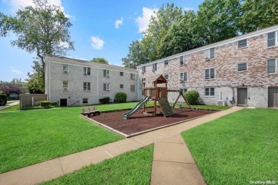 Welcome to this bright, first-floor corner unit in Trousdell on Glen Head Country Club in New York - for sale on GolfHomes.com, golf home, golf lot