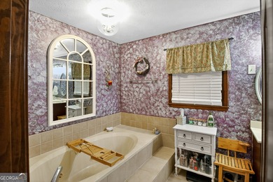 Welcome to this beautifully maintained Colonial-style brick home on West Pines Golf Club in Georgia - for sale on GolfHomes.com, golf home, golf lot