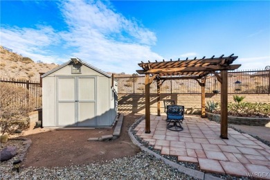 Welcome to the good life at Laughlin Ranch! Tucked at the end of on Laughlin Ranch Golf Club in Arizona - for sale on GolfHomes.com, golf home, golf lot