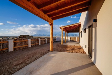 Discover the perfect blend of modern luxury and Southwest charm on Taos Country Club in New Mexico - for sale on GolfHomes.com, golf home, golf lot