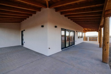 Discover the perfect blend of modern luxury and Southwest charm on Taos Country Club in New Mexico - for sale on GolfHomes.com, golf home, golf lot