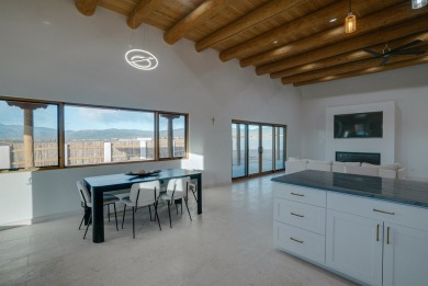 Discover the perfect blend of modern luxury and Southwest charm on Taos Country Club in New Mexico - for sale on GolfHomes.com, golf home, golf lot