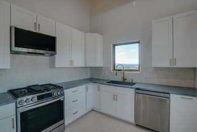 Discover the perfect blend of modern luxury and Southwest charm on Taos Country Club in New Mexico - for sale on GolfHomes.com, golf home, golf lot