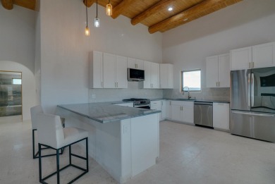 Discover the perfect blend of modern luxury and Southwest charm on Taos Country Club in New Mexico - for sale on GolfHomes.com, golf home, golf lot