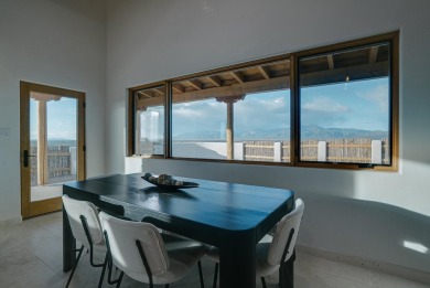 Discover the perfect blend of modern luxury and Southwest charm on Taos Country Club in New Mexico - for sale on GolfHomes.com, golf home, golf lot