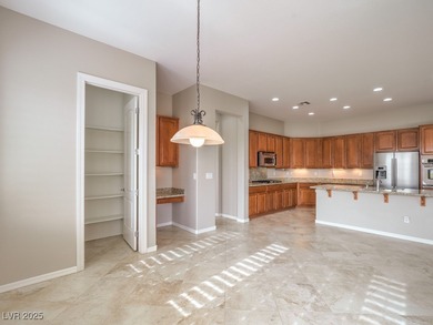 Refined desert living on this elevated Charleston model offering on Revere Golf Club in Nevada - for sale on GolfHomes.com, golf home, golf lot