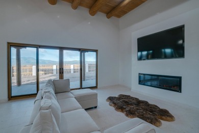 Discover the perfect blend of modern luxury and Southwest charm on Taos Country Club in New Mexico - for sale on GolfHomes.com, golf home, golf lot