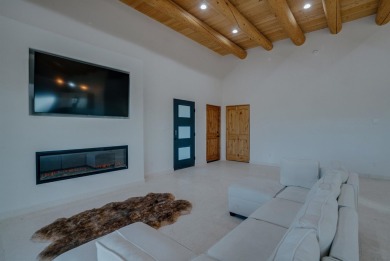 Discover the perfect blend of modern luxury and Southwest charm on Taos Country Club in New Mexico - for sale on GolfHomes.com, golf home, golf lot