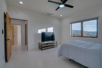 Discover the perfect blend of modern luxury and Southwest charm on Taos Country Club in New Mexico - for sale on GolfHomes.com, golf home, golf lot
