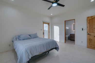 Discover the perfect blend of modern luxury and Southwest charm on Taos Country Club in New Mexico - for sale on GolfHomes.com, golf home, golf lot