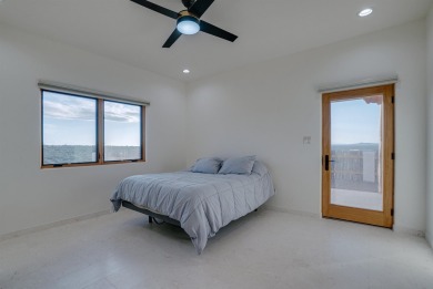 Discover the perfect blend of modern luxury and Southwest charm on Taos Country Club in New Mexico - for sale on GolfHomes.com, golf home, golf lot