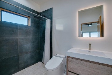 Discover the perfect blend of modern luxury and Southwest charm on Taos Country Club in New Mexico - for sale on GolfHomes.com, golf home, golf lot