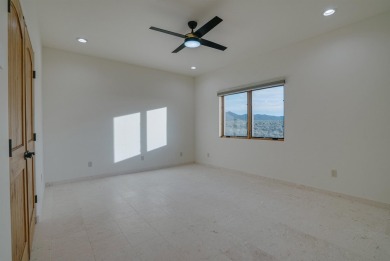 Discover the perfect blend of modern luxury and Southwest charm on Taos Country Club in New Mexico - for sale on GolfHomes.com, golf home, golf lot