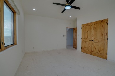 Discover the perfect blend of modern luxury and Southwest charm on Taos Country Club in New Mexico - for sale on GolfHomes.com, golf home, golf lot