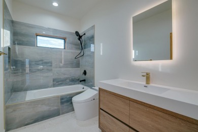Discover the perfect blend of modern luxury and Southwest charm on Taos Country Club in New Mexico - for sale on GolfHomes.com, golf home, golf lot