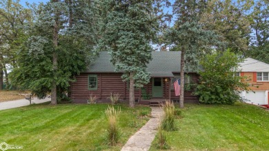 This charming cabin-style family home has been completely redone on All Vets Golf Club in Iowa - for sale on GolfHomes.com, golf home, golf lot