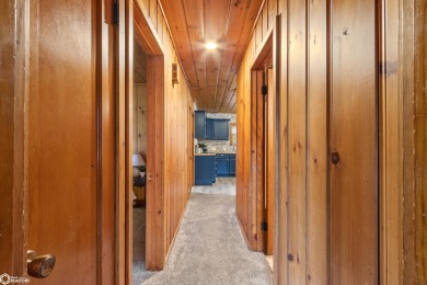 This charming cabin-style family home has been completely redone on All Vets Golf Club in Iowa - for sale on GolfHomes.com, golf home, golf lot
