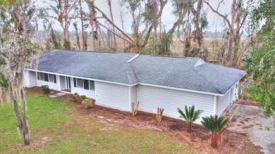 This charming home is nestled on the edge of Ocean Pond on Francis Lake Golf Club in Georgia - for sale on GolfHomes.com, golf home, golf lot