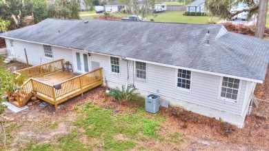 This charming home is nestled on the edge of Ocean Pond on Francis Lake Golf Club in Georgia - for sale on GolfHomes.com, golf home, golf lot