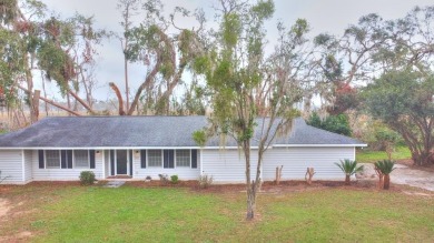 This charming home is nestled on the edge of Ocean Pond on Francis Lake Golf Club in Georgia - for sale on GolfHomes.com, golf home, golf lot