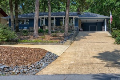 Love lake life? This freshly painted and transformed home is on DeSoto Golf Course in Arkansas - for sale on GolfHomes.com, golf home, golf lot