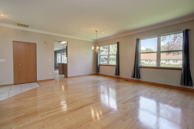This description highlights a spacious Carmel model home on The Links at Carillon in Illinois - for sale on GolfHomes.com, golf home, golf lot