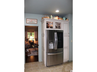 This beautifully crafted custom brick duplex is full of charm on Rolling Hills Country Club in Kentucky - for sale on GolfHomes.com, golf home, golf lot