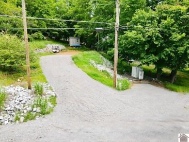 Discover an exceptional opportunity to build your dream home on Mineral Mound Golf Course in Kentucky - for sale on GolfHomes.com, golf home, golf lot