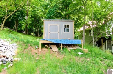 Discover an exceptional opportunity to build your dream home on Mineral Mound Golf Course in Kentucky - for sale on GolfHomes.com, golf home, golf lot
