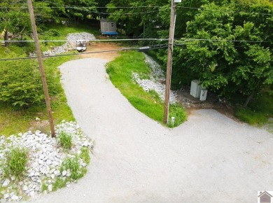 Discover an exceptional opportunity to build your dream home on Mineral Mound Golf Course in Kentucky - for sale on GolfHomes.com, golf home, golf lot