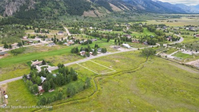 Great, ready-to-build lot offering expansive mountain views and on Cedar Creek Golf Course in Wyoming - for sale on GolfHomes.com, golf home, golf lot