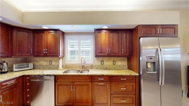 Welcome to this charming 2-bedroom, 2-bathroom villa with a den on Cypress Lake Country Club in Florida - for sale on GolfHomes.com, golf home, golf lot