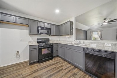 Tucked away in a well-established neighborhood and less than a on White Hawk Golf Club in Oklahoma - for sale on GolfHomes.com, golf home, golf lot