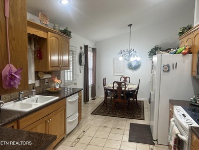 Discover this nicely maintained home on a combined double lot on Lake Tansi Village Country Club in Tennessee - for sale on GolfHomes.com, golf home, golf lot