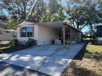 This 2/2 home will be offered fully furnished and it includes on Lake Henry Golf Club in Florida - for sale on GolfHomes.com, golf home, golf lot