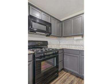 Tucked away in a well-established neighborhood and less than a on White Hawk Golf Club in Oklahoma - for sale on GolfHomes.com, golf home, golf lot