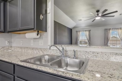 Tucked away in a well-established neighborhood and less than a on White Hawk Golf Club in Oklahoma - for sale on GolfHomes.com, golf home, golf lot