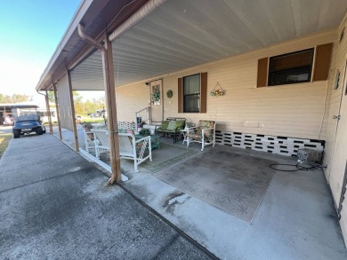 This 2/2 home will be offered fully furnished and it includes on Lake Henry Golf Club in Florida - for sale on GolfHomes.com, golf home, golf lot