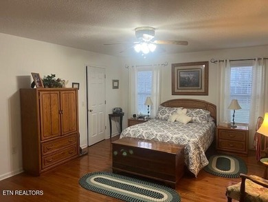 Discover this nicely maintained home on a combined double lot on Lake Tansi Village Country Club in Tennessee - for sale on GolfHomes.com, golf home, golf lot